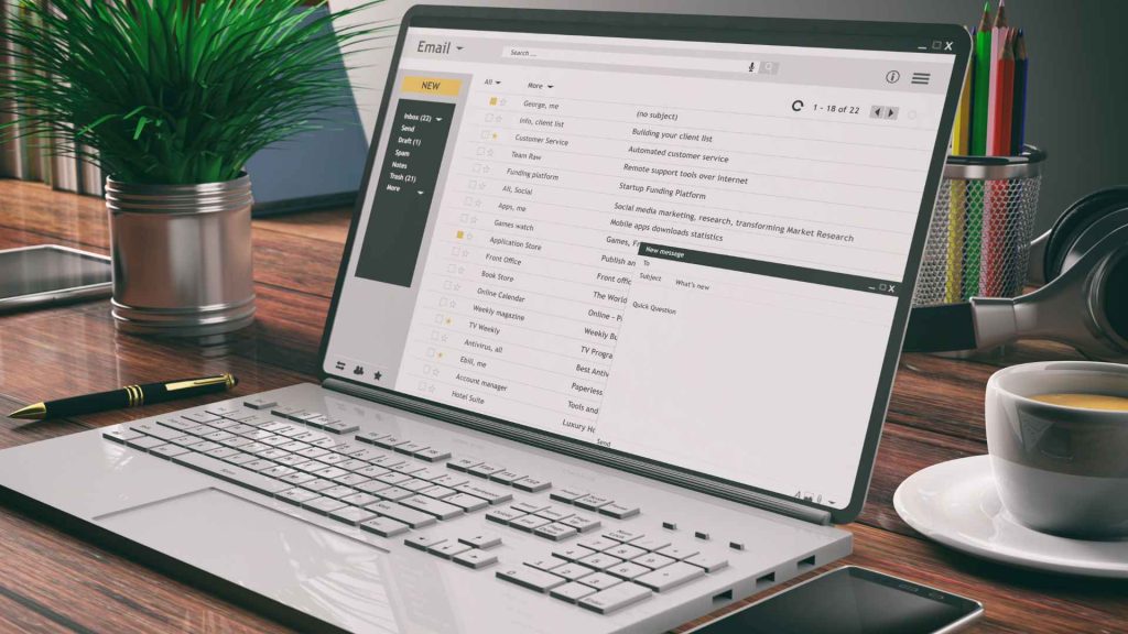 Email Campaign Automation on Laptop – A close-up of hands typing on a laptop, sending bulk email campaigns with automation software.
