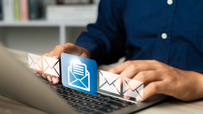 Global Email Marketing Strategy Concept – A businessman holding a digital globe, symbolizing international email marketing outreach.